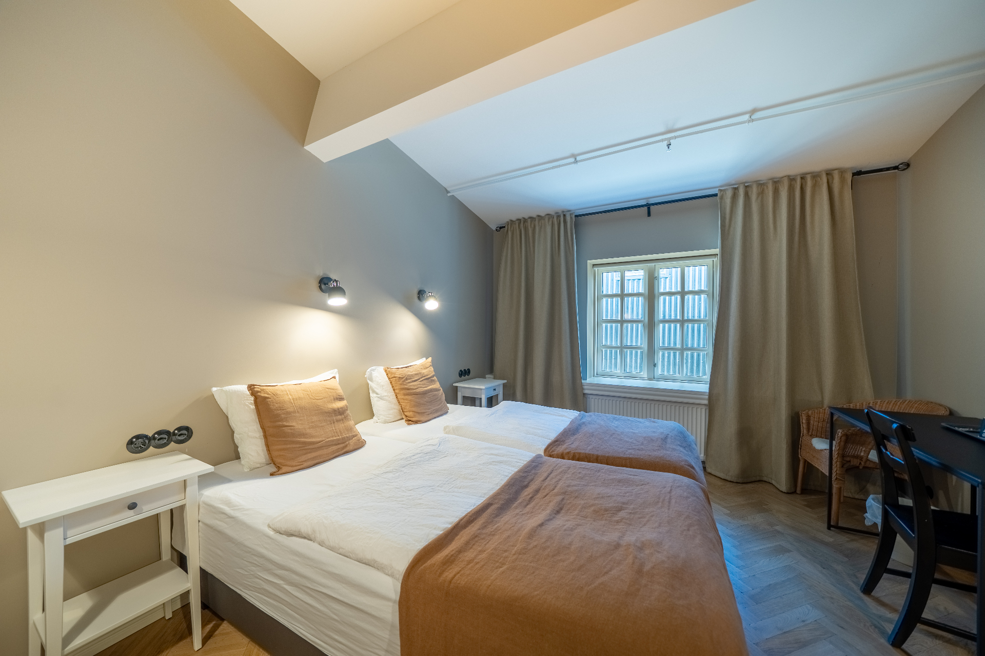 Economy room with paned window and curtains