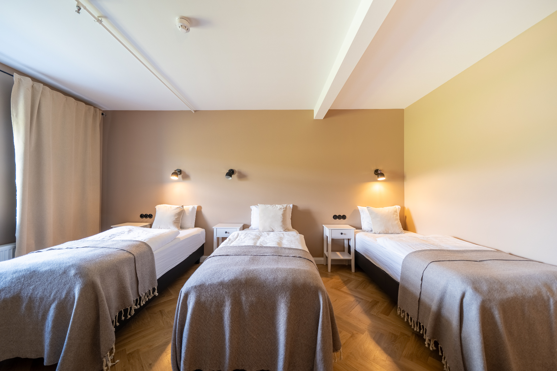 Three single beds in the family room at The Barn