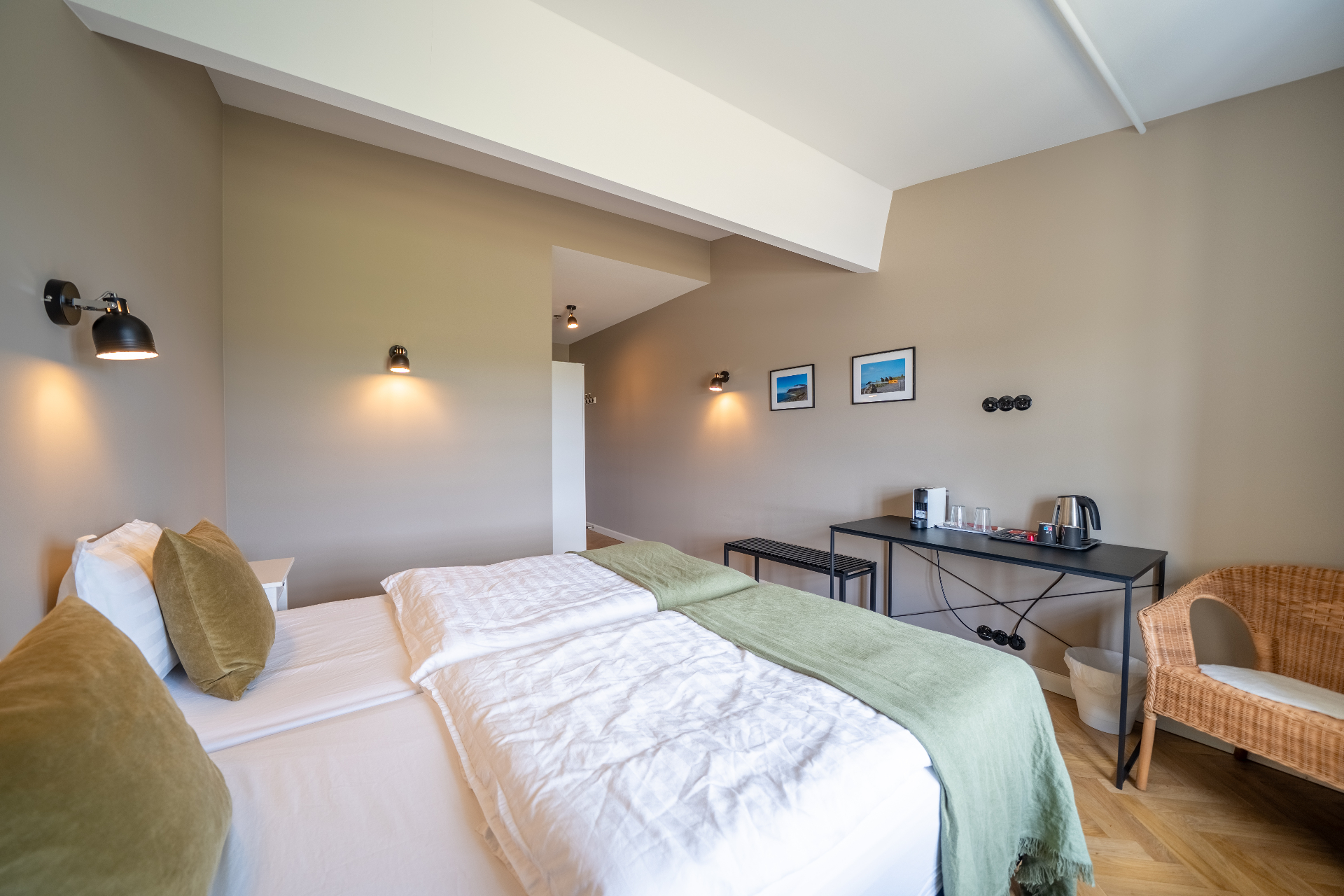 Superior room with coffee station and wicker chair