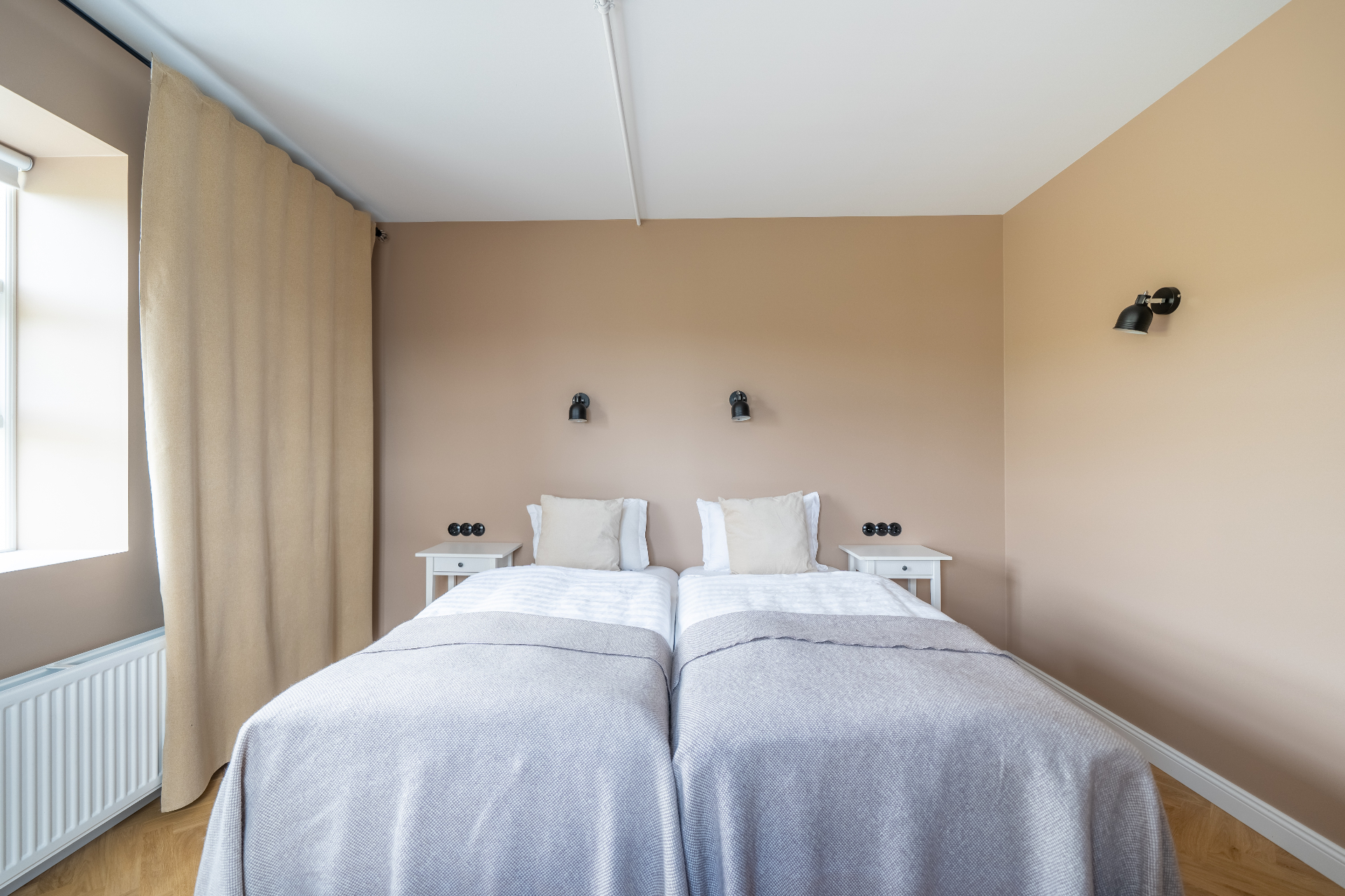 Twin beds viewed from the foot of the bed