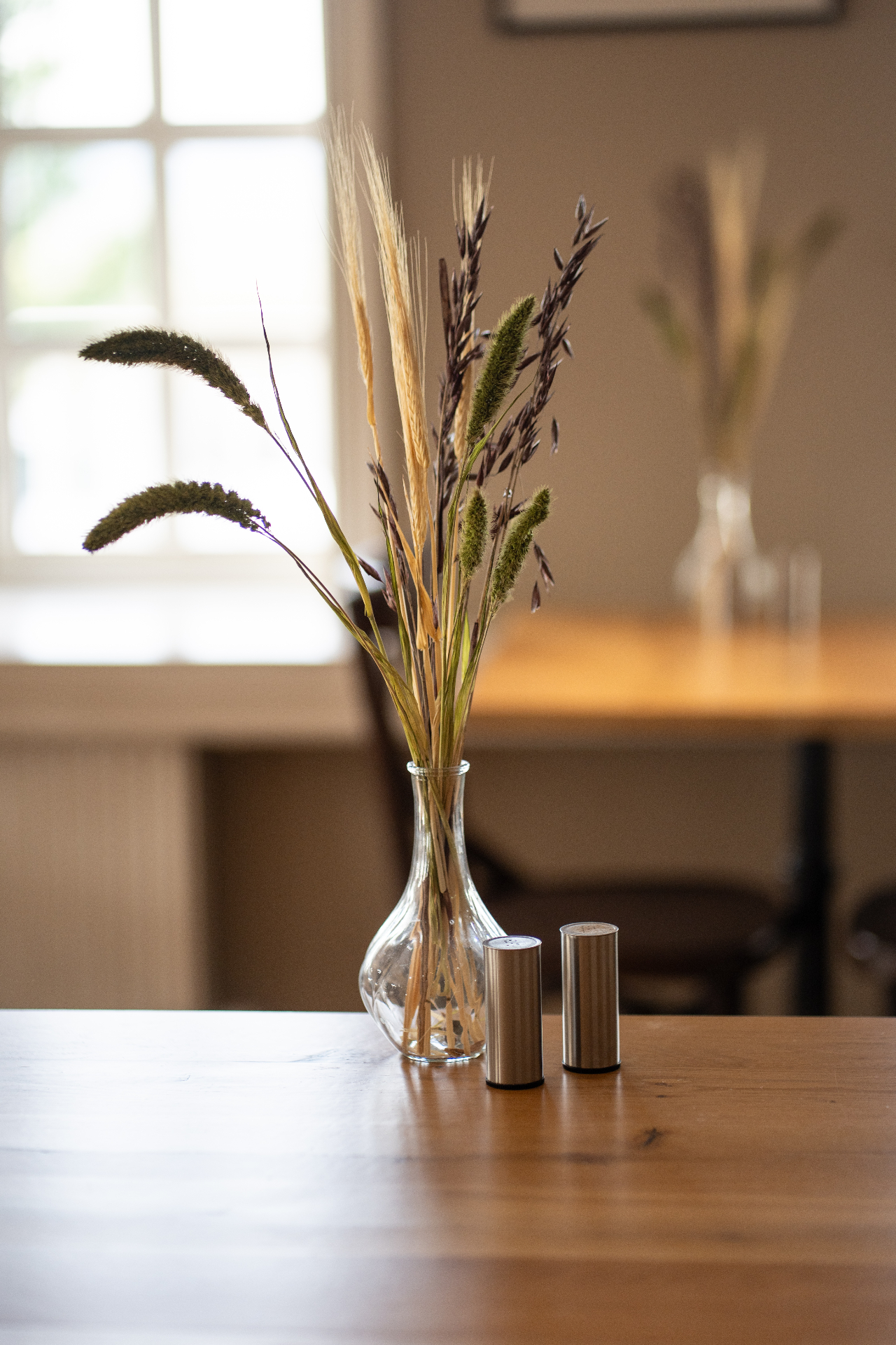 Breakfast table set with skyr, muesli, fresh juice and open sandwiches